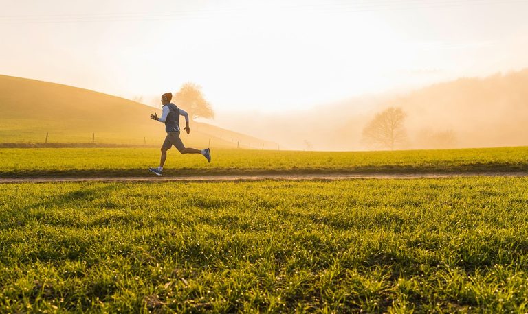 Image of a man running in the field